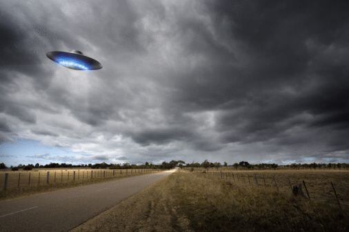 Digital illustrated UFO on country road.