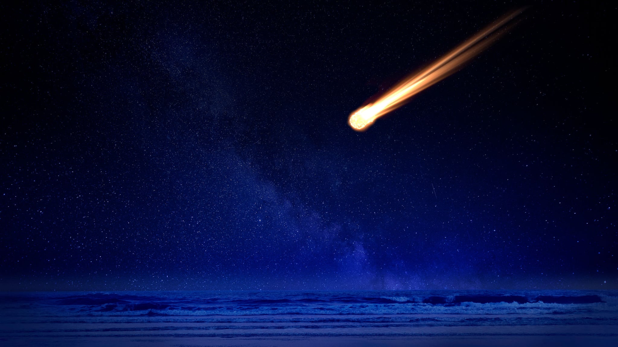 Ilustración genérica de un meteorito cayendo sobre el mar.